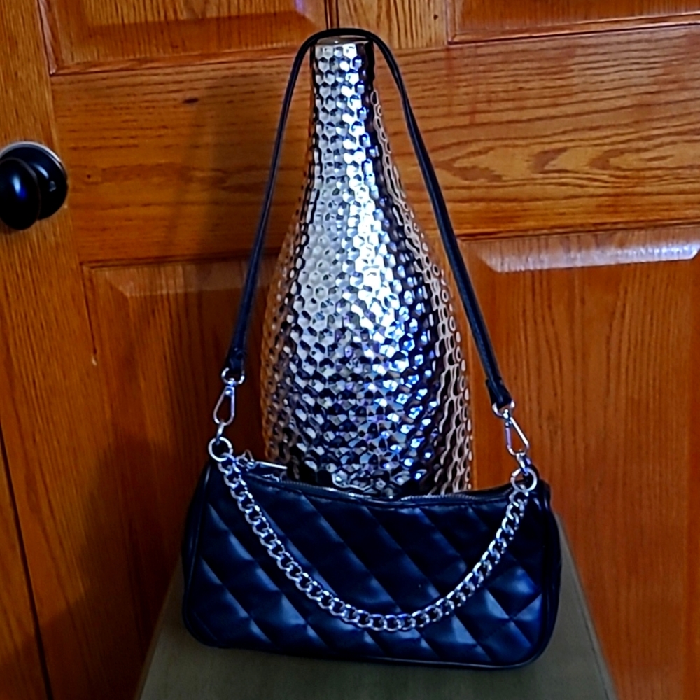Unknown, small, black faux leather quilted shoulder purse.
